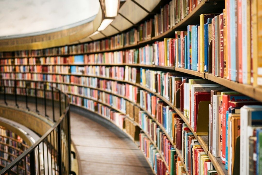 Curved university library shelves filled with colorful research books