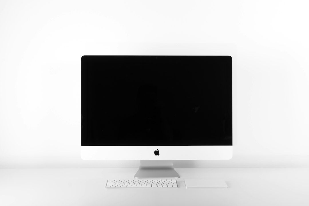 Desktop computer with a blank screen, keyboard, and mouse